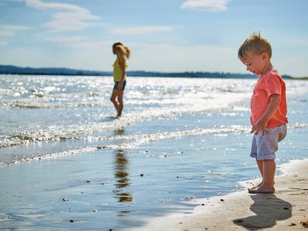 Child on beach at Parkdean's Camber Sands Holiday Park