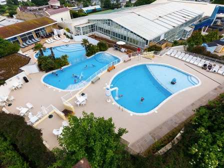 Aerial view of swimming pools at Devon Cliffs Holiday Park