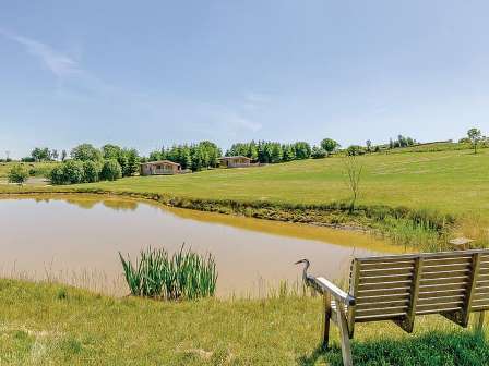 Lake with bench at Hazelhurst Lodges in Derbyshire