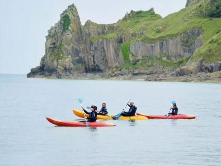 Kayakers in the sea at Lydstep Beach Holiday Park