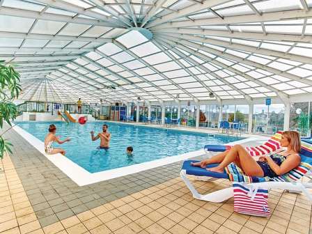 Holidaymakers using swimming pool at Heachem Beach Holiday Park