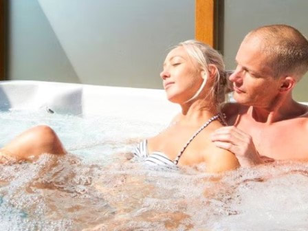 Couple in hot tub at St Ives Holiday Village